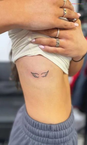 Angel Wing Tattoo With A Halo On Top