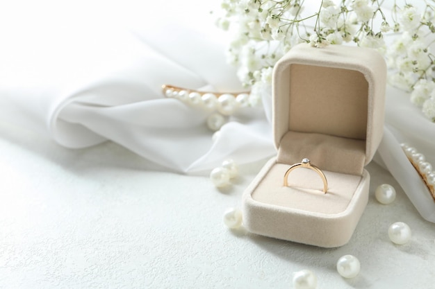 Concept of wedding accessories with wedding ring, close up Free Photo