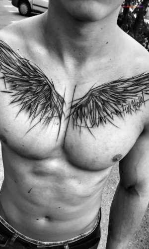 Simple And Minimalistic Angel Wings Tattoo On The Chest